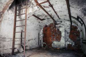 Old empty abandoned bunker interior with white walls