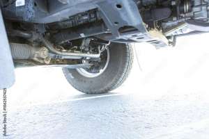 High quality underneath springs, shocks, axles photo of a Regular Cab  Japanese American pickup truck 4x4 off-road SUV vehicle