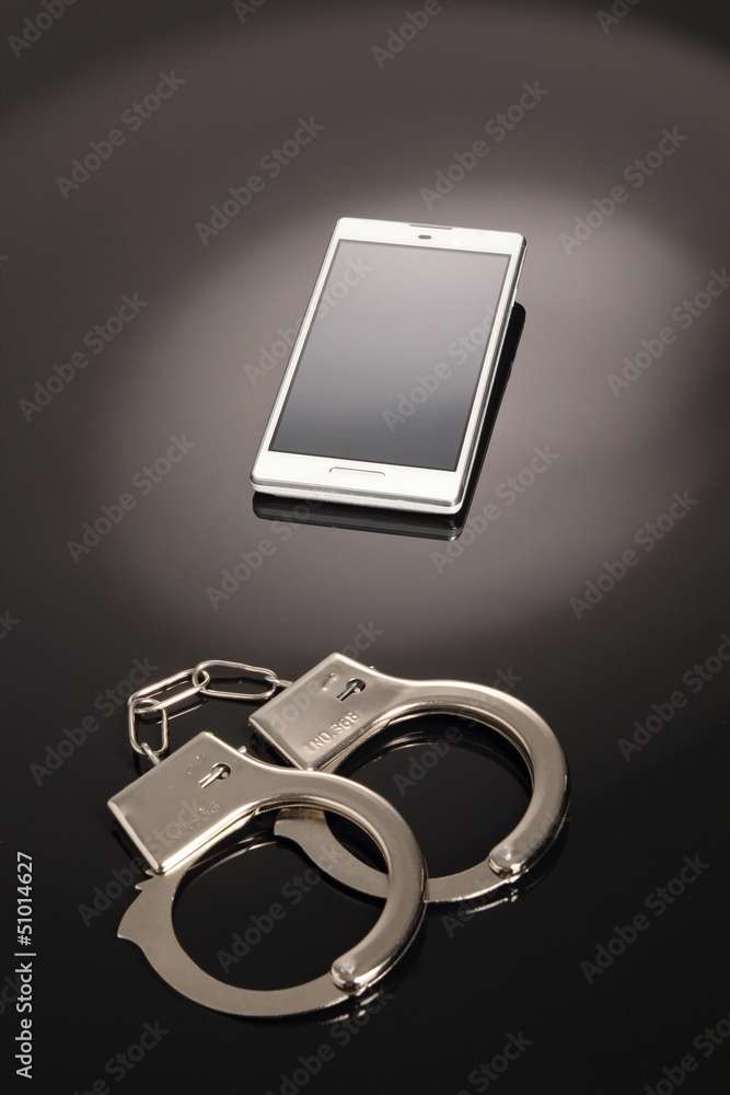 Handy und Handschellen